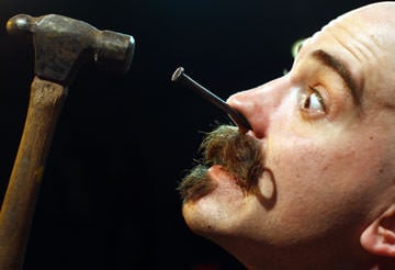 Donny Vomit performing his "Human Blockhead" act. Photo by Mike Segar, Reuters.