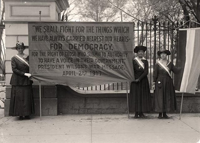 Suffragettes protest outside the White House. Photo courtesy of the Library of Congress. 