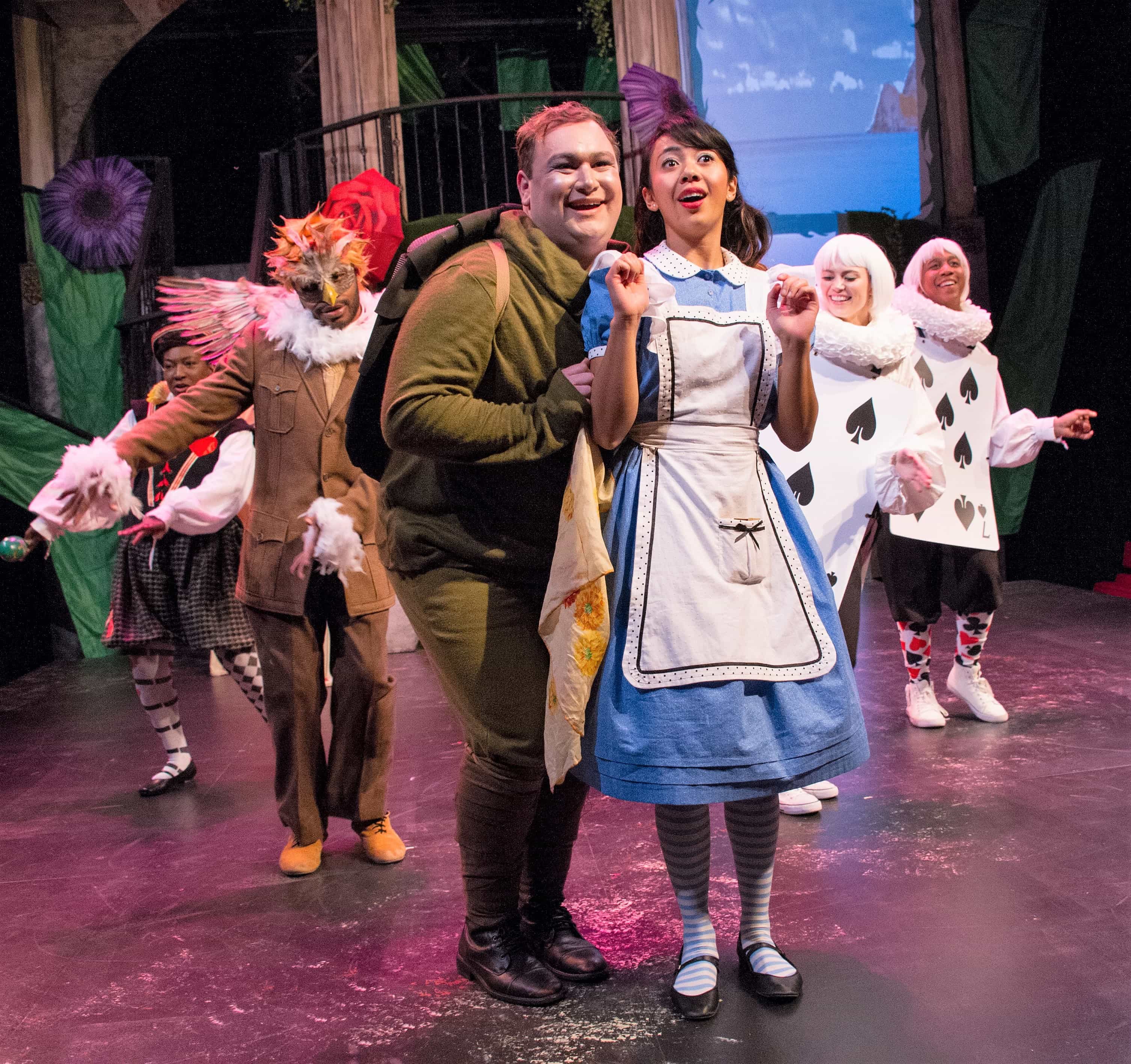 The Mock Turtle (Gregory Atkin) and Alice (Alexandra Palting) dance the Lobster Quadrille, with help from Knave of Spades (Mabelle Fomundam), Gryphon (Terrance Fleming), Five of Spades (Hannah McKechnie), and Seven of Spaces (JC Payne). Costumes by Kristina Lambdin. Photo by C. Stanley Photography.