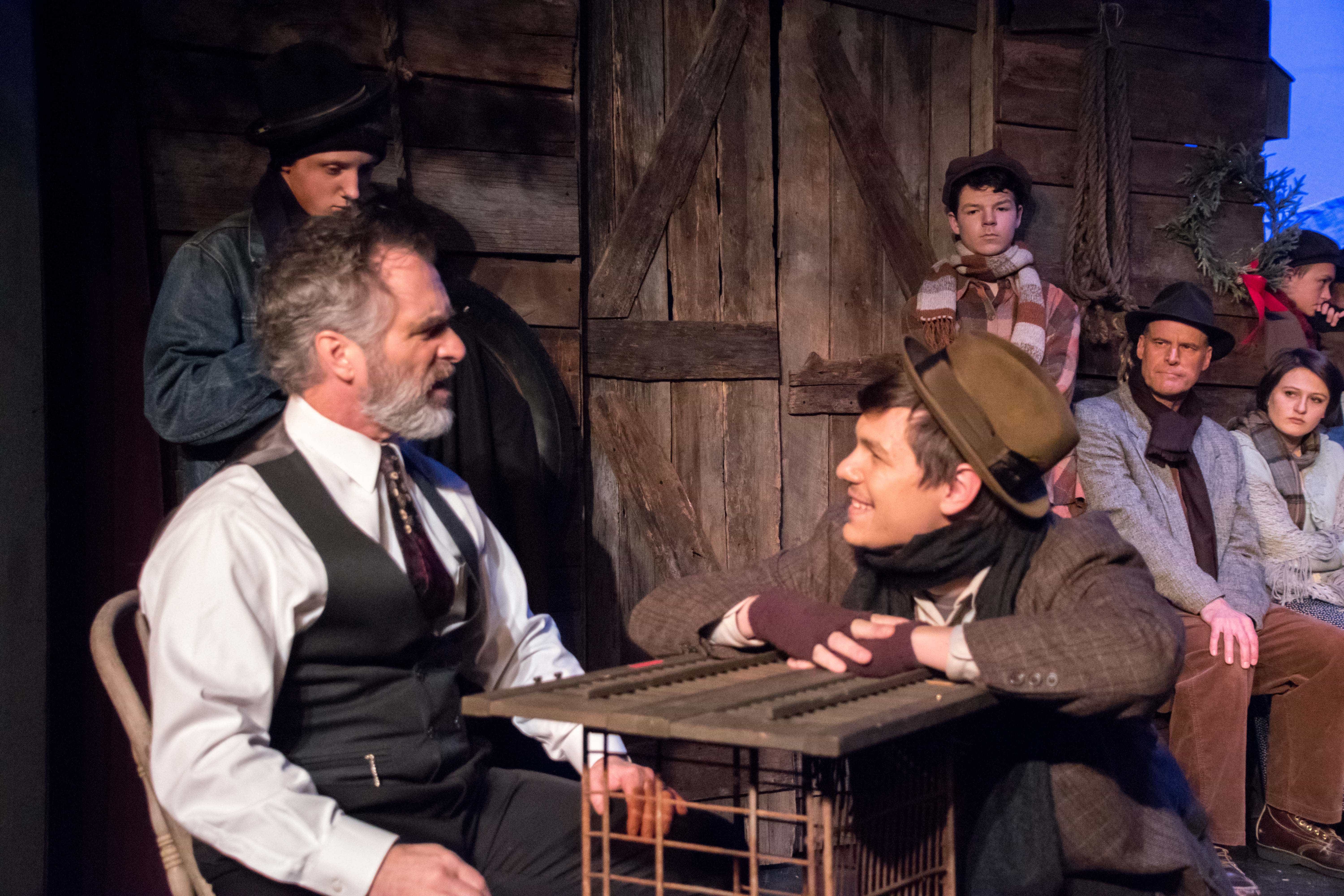 David Whitehead (Scrooge) and Kyle McClain (Nephew Fred) in the Providence Players of Fairfax production of A Christmas Carol. Photo by Chip Gertzog.