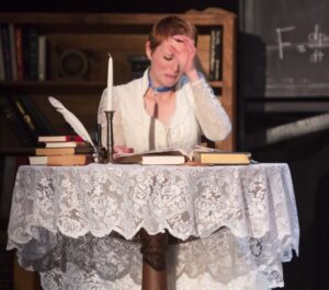 Heather Plank as Émilie in Vienna Theatre Company’s production of Émilie: La Marquise Du Châtelet Defends Her Life Tonight. Photo by John Sharrard.