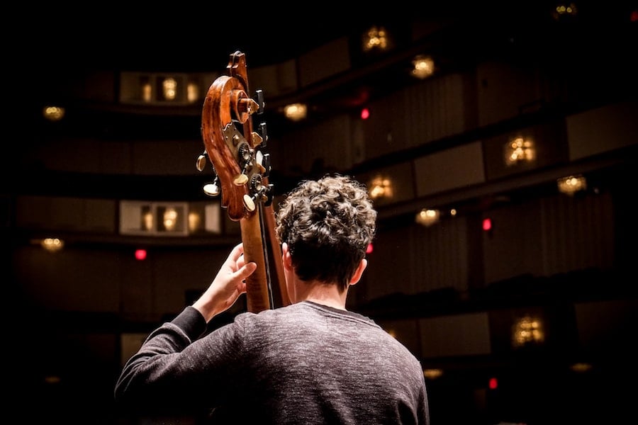 RCO’s bass section, and their special chairs, hard at work preparing for the upcoming concert. Photo by Samantha Pollack. 