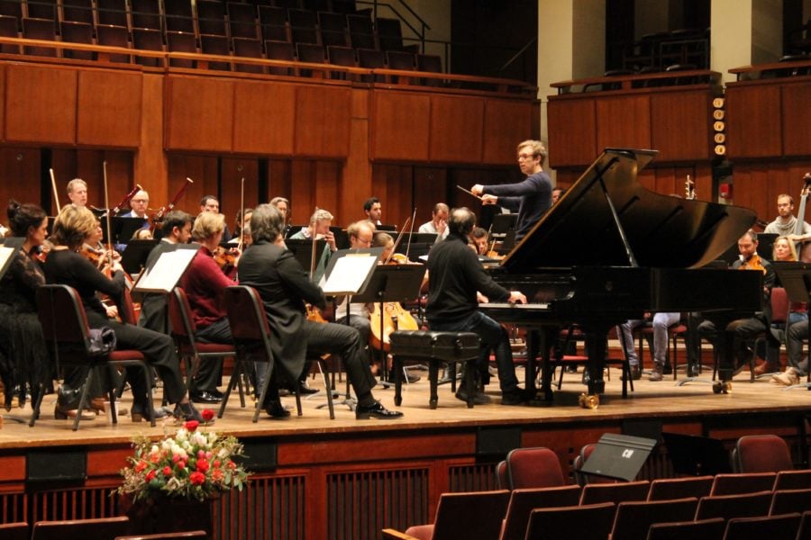 Concert time draws near, and the full orchestra assembles to run through the program. Photo by Samantha Pollack.