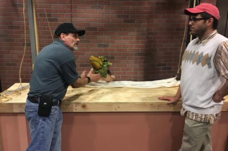 Puppeteer Bill Diamond, Liz Colandene (partially obscured, puppet performer) and Casey Fero (Seymour) in rehearsal for 'Little Shop of Horrors' at Workhouse Arts Center. Photo courtesy of Workhouse Arts Center.
