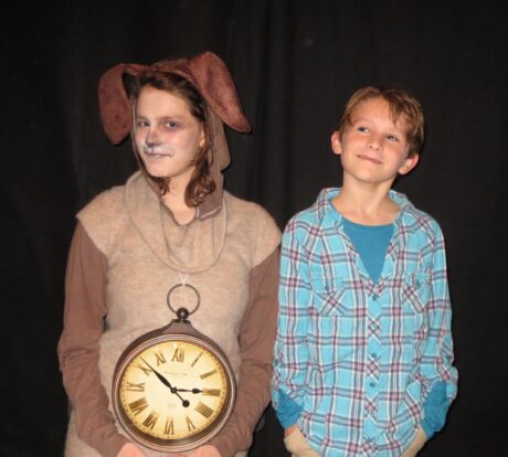 The watchdog Tock (Findley Holland) accompanies Milo (Harper Chadwick) on a quest to rescue the princesses in 'The Phantom Tollbooth' at Greenbelt Arts Center. Photo by Anne Gardner.