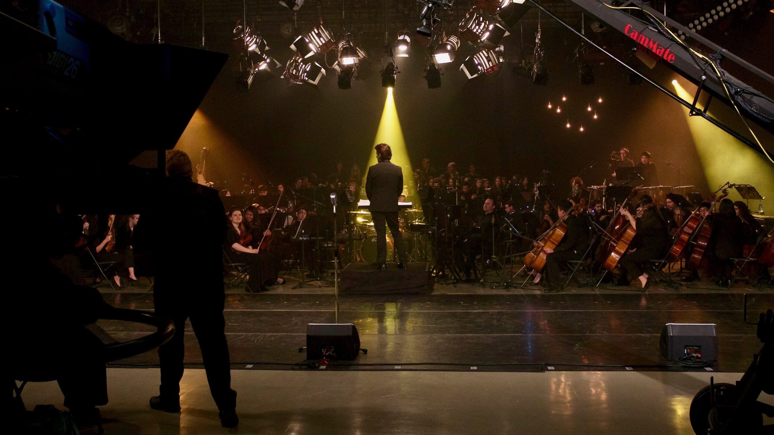 Maestro Kristofer Sanz with Young Artists of America Orchestra. Photo by Carmelita Watkinson.