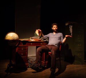 Iason Togias as the Poet in An Iliad, now playing at Atlas Performing Arts Center. Photo by Ryan Maxwell Photography.