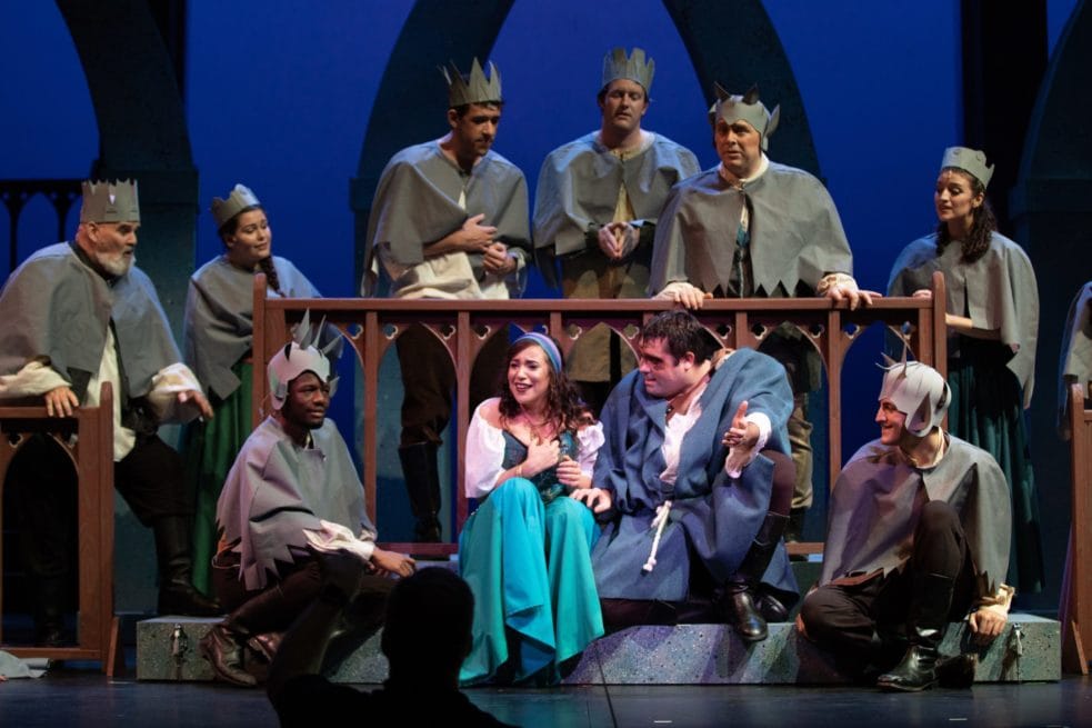 Alex Bryce as Quasimodo, Adelina Mitchell as Esmerelda, surrounded by members of the ensemble. Photo by Peter Hill.