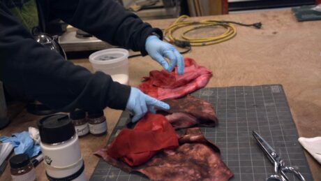 STC Properties Assistant Rebecca Williams tests fabric dye. Photo courtesy of Shakespeare Theatre Company.