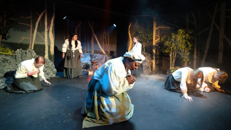 Left to Right: Sarah Luckadoo (Ann Putnam Jr.), Malissa Cruz Romero (Abigail Williams),Ashanti Cooper (Tituba), Emily Groves (Betty Parris), Julie Rogers (Mary Warren), Megan Safko (Mercy Lewis). Photo courtesy of Laurel Mill Playhouse.